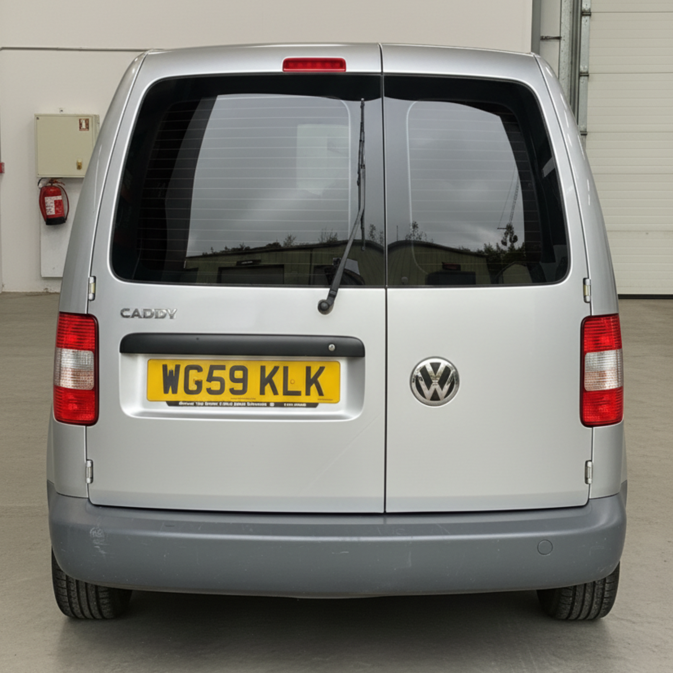 Silver VW Caddy Van before van graphics were applied